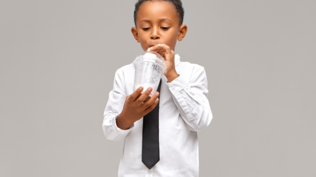 child drinking juice
