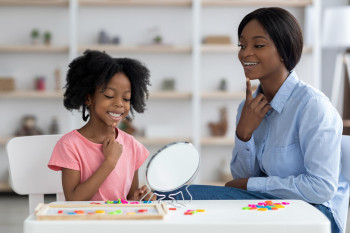 Mum smiling with child