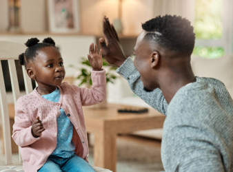 Parent high fiving kid